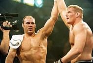 Randy Couture raises Josh Barnett's hand in victory